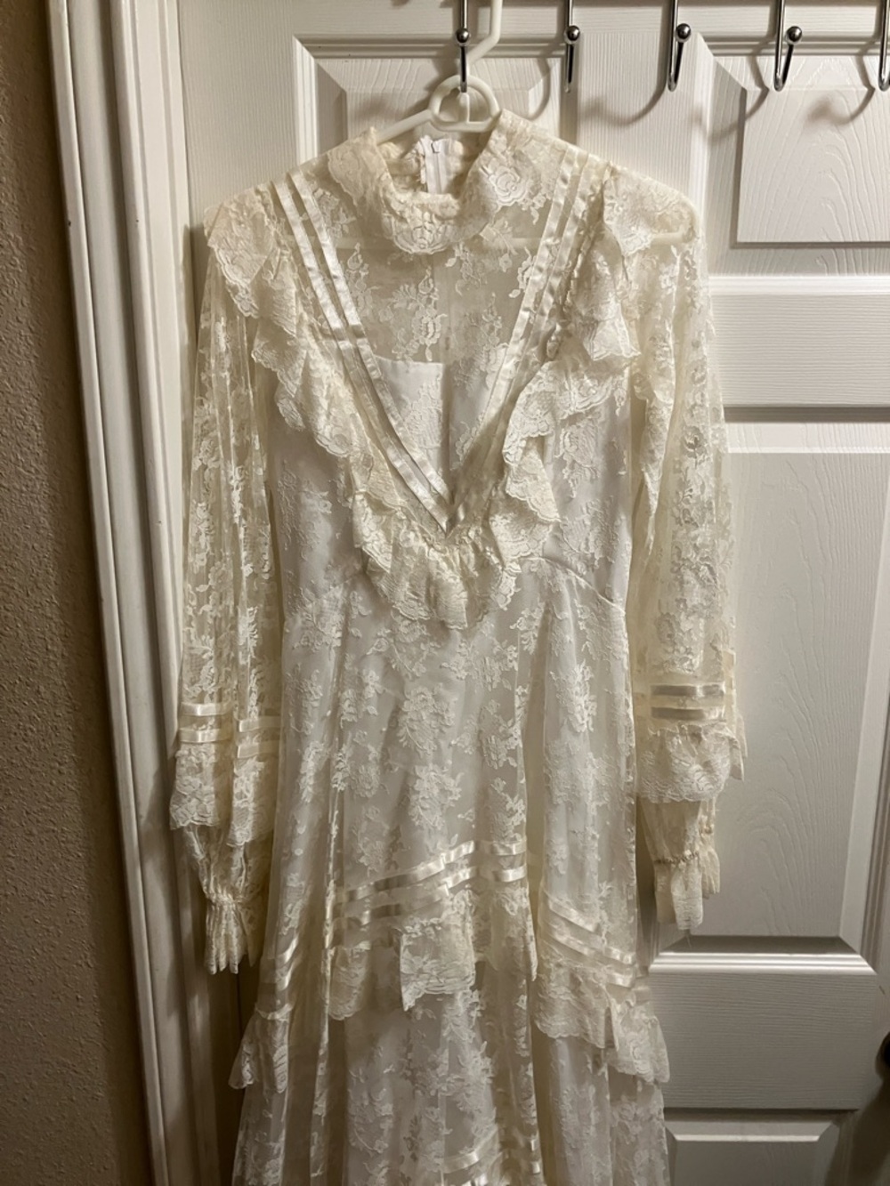Vintage-Inspired Cream Lace Wedding Dress with High Neck Ruffle